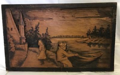 Wood Carving: Man with boat, woman, and church