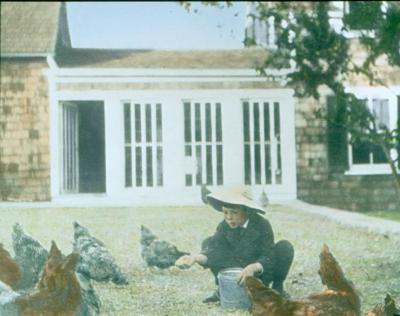 MOW_175_Child Feeding Chickens